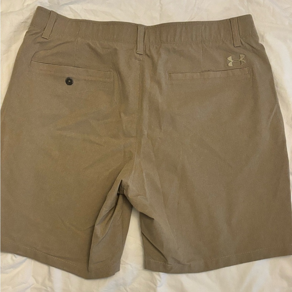 Under Armour golf shorts.